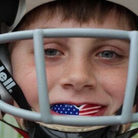 youth football with USA flag sports mouth guard for kids
